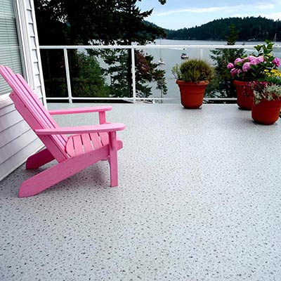 Duradek Supreme Chip Granite Vinyl Decking and Glass Railing with White Posts